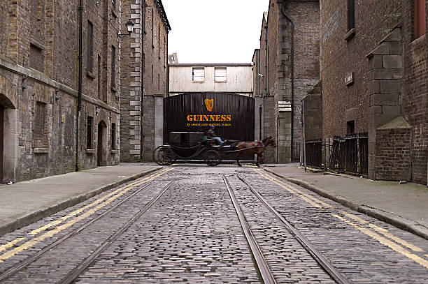 Dublin, Ireland - December 14, 2008: Carriage in transit in front of the entrance gate at the Guinness Storehouse on December 14, 2008 in Dublin, Ireland. The Guinness Storehouse is a popular tourist attraction with 1,087,209 visitors in 2012.