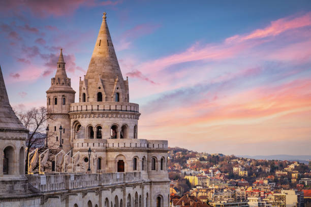 Colorful twilight over the famous historical main neo-romanesque Lookout Tower of Fishermen's Bastion - Halaszbastya - built between 1895-1902 uphill on the Buda Bank of the Danube River. Várkerület District, Budapest. Budapest, Hungary, Eastern Europe