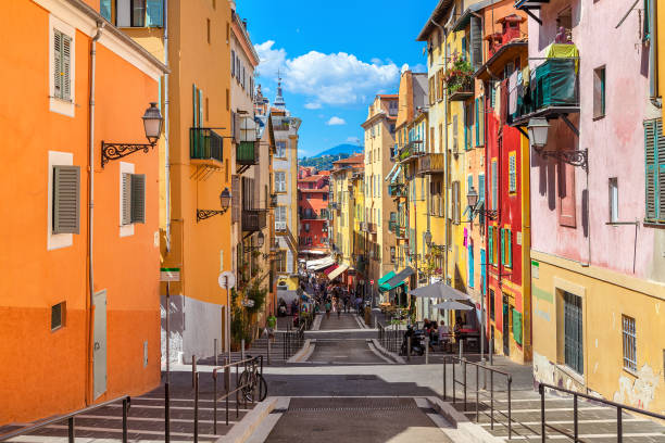Nice: Narrow street in old tourist part of Nice - fifth most populous city and one of the most visited cities in France, receiving 4 million tourists every year.