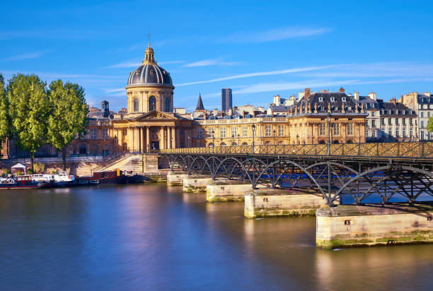 Pont des Arts leading towards Institut de France, Paris, France. The bridge is a popular place for couples in Europe.