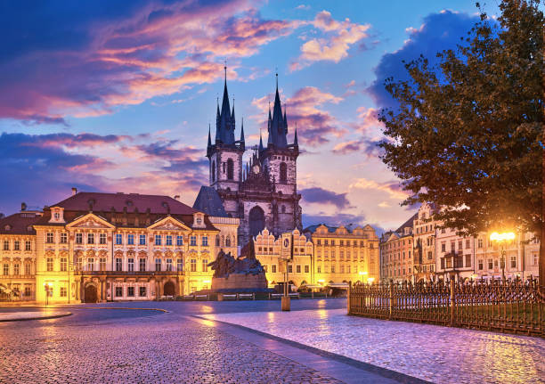 Church of our lady before tyn on Old Town Square Prague Czech republic with red roof sunset sky.