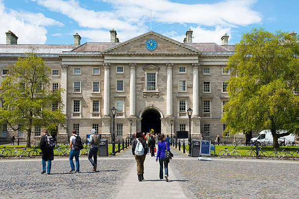 Dublin, Ireland - June 13, 2013: People walk on the campus of Trinity College, which was founded by Queen Elizabeth 1 in 1592.